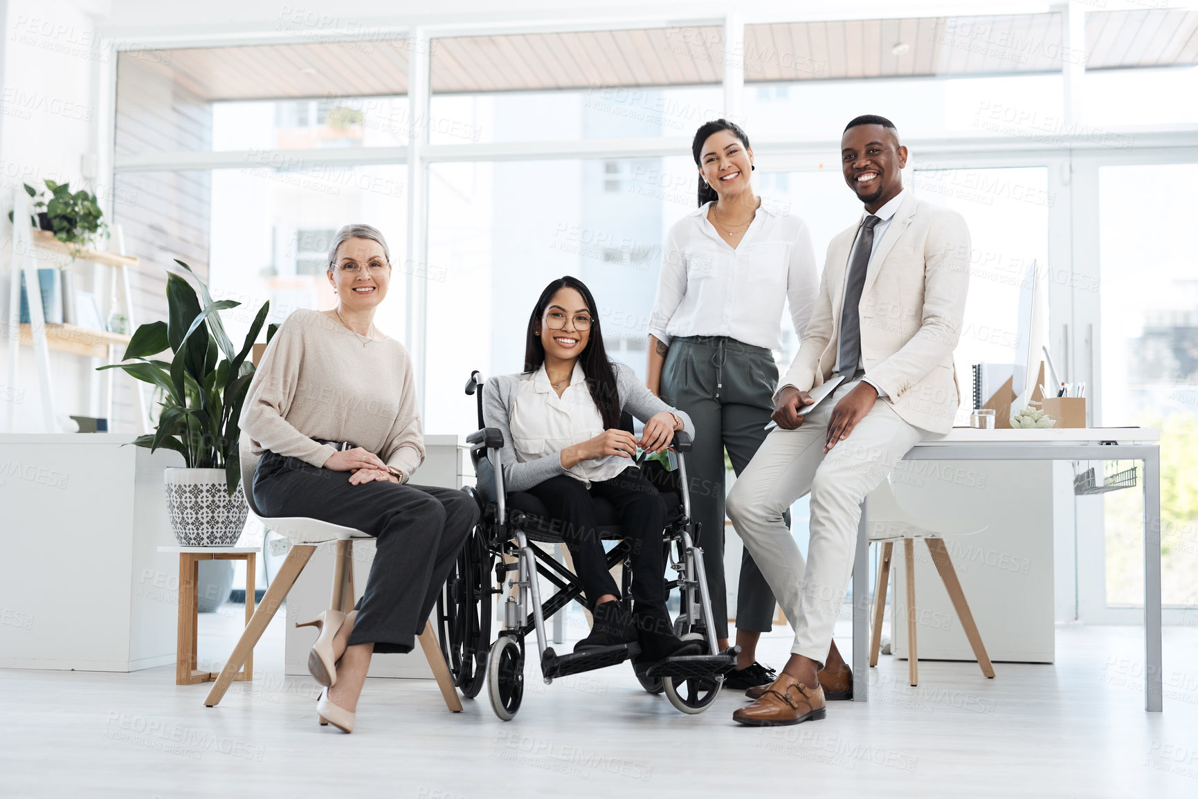 Buy stock photo Full length portrait of a group of diverse businesspeople gathered in their office