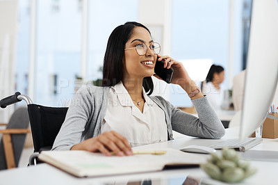 Buy stock photo Cropped shot of an attractive young businesswoman making a phonecall while working at her desk in the office