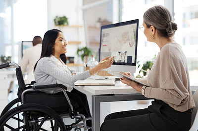 Buy stock photo Cropped shot of an attractive young businesswoman getting some information from her human resources manager in the office