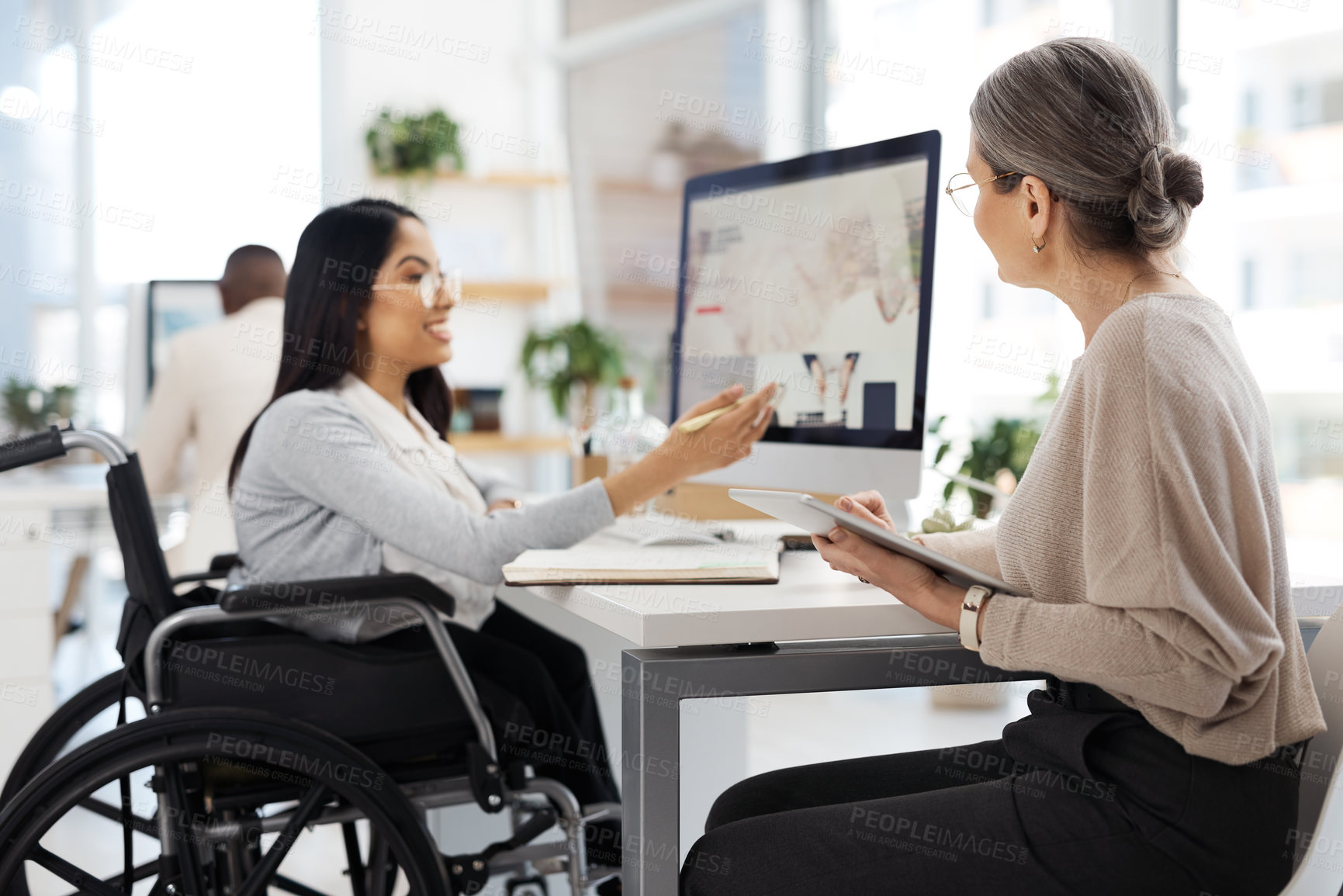 Buy stock photo Cropped shot of an attractive young businesswoman getting some information from her human resources manager in the office