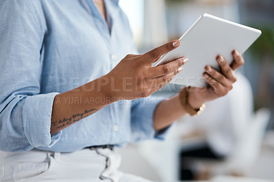 Buy stock photo Closeup shot of an unrecognisable businesswoman using a digital tablet in an office