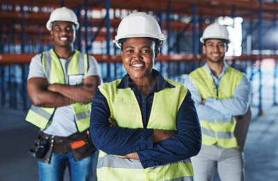 Buy stock photo Shot of a group of contractors standing in the warehouse together with their arms folded