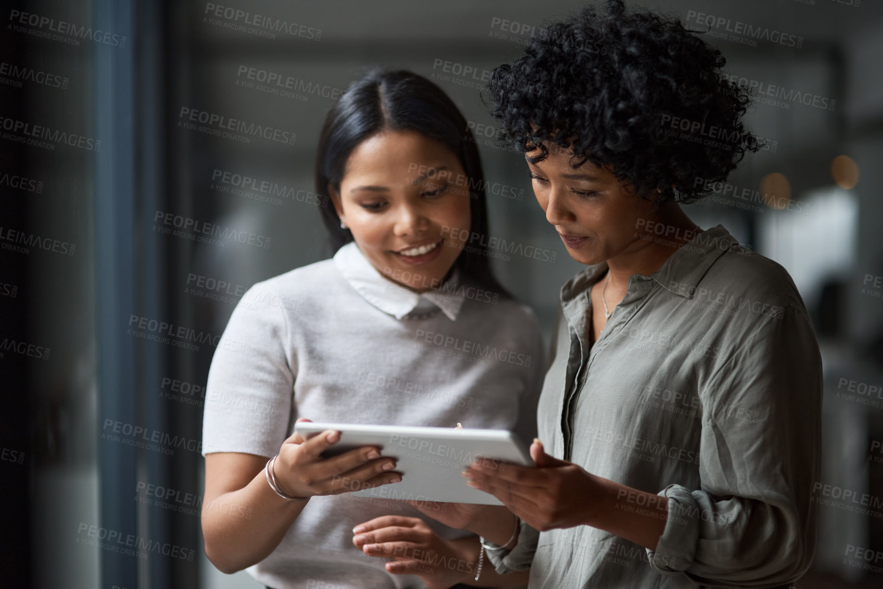 Buy stock photo Shot of Two businesswoman working in a modern office