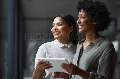 Buy stock photo Shot of Two businesswoman working in a modern office