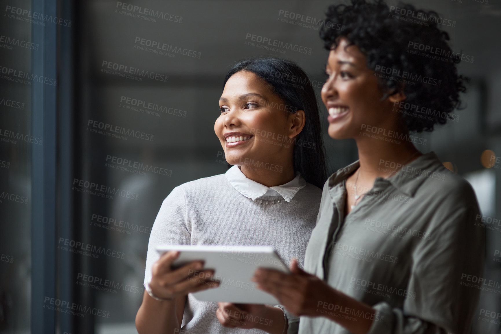 Buy stock photo Shot of Two businesswoman working in a modern office