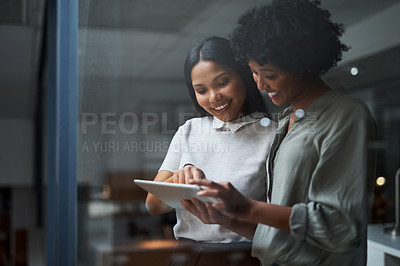 Buy stock photo Shot of Two businesswoman working in a modern office