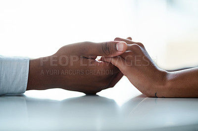 Buy stock photo Cropped of two unrecognizable people holding hands inside of the office during the day