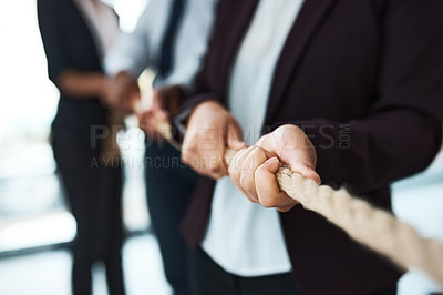 Buy stock photo Cropped shot of unrecognizable businesspeople pulling on a rope