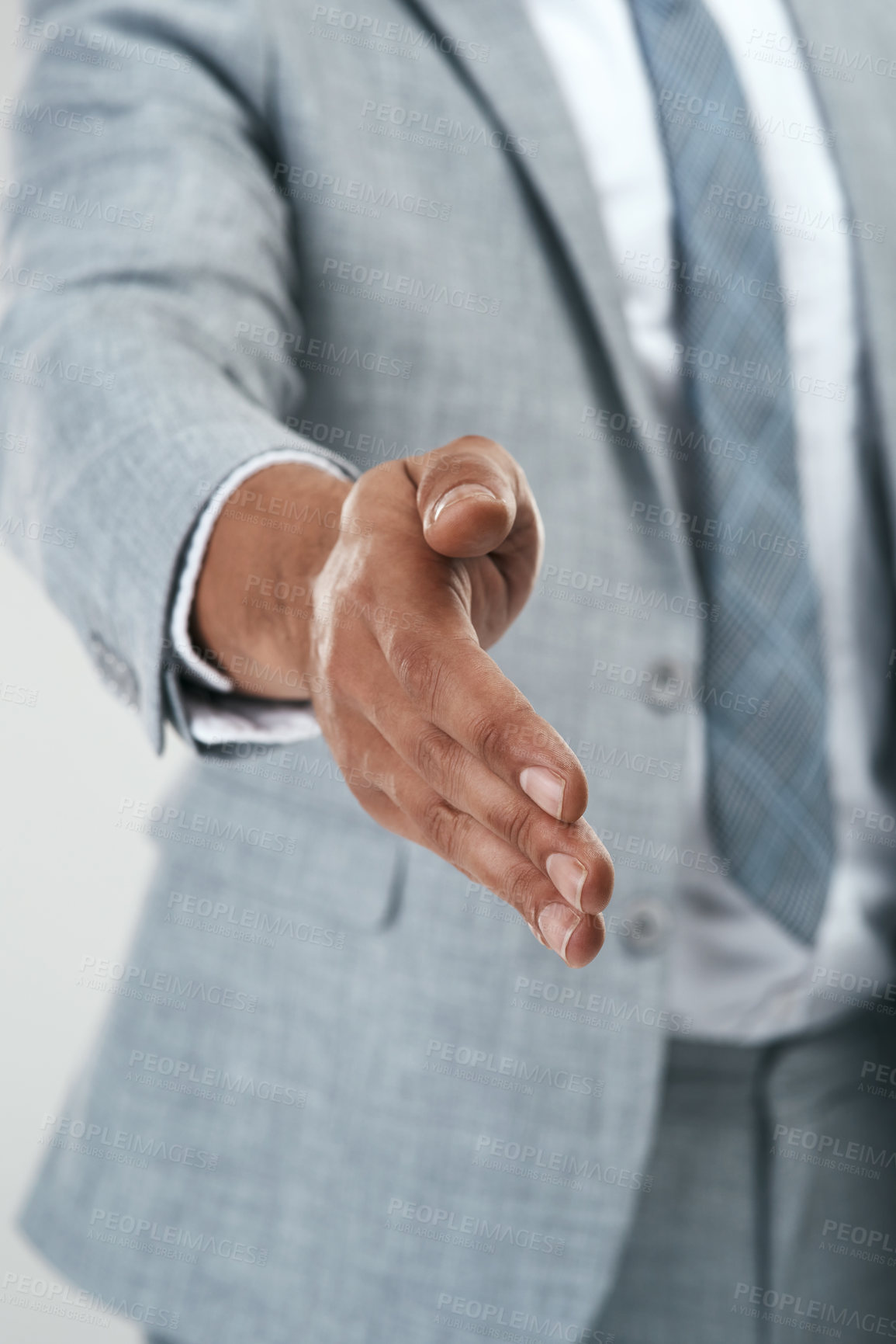 Buy stock photo Cropped shot of an unrecognizable businessman holding his hand out for a handshake