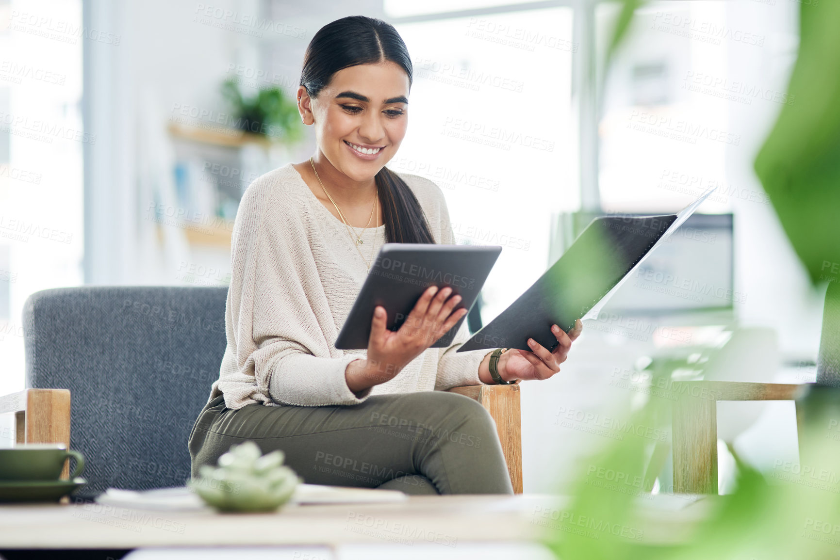 Buy stock photo Happy, woman and tablet with paperwork in office for garden writer, online review and compare info. Smile, person and tech with file for sustainable article research, verify source and plant care app