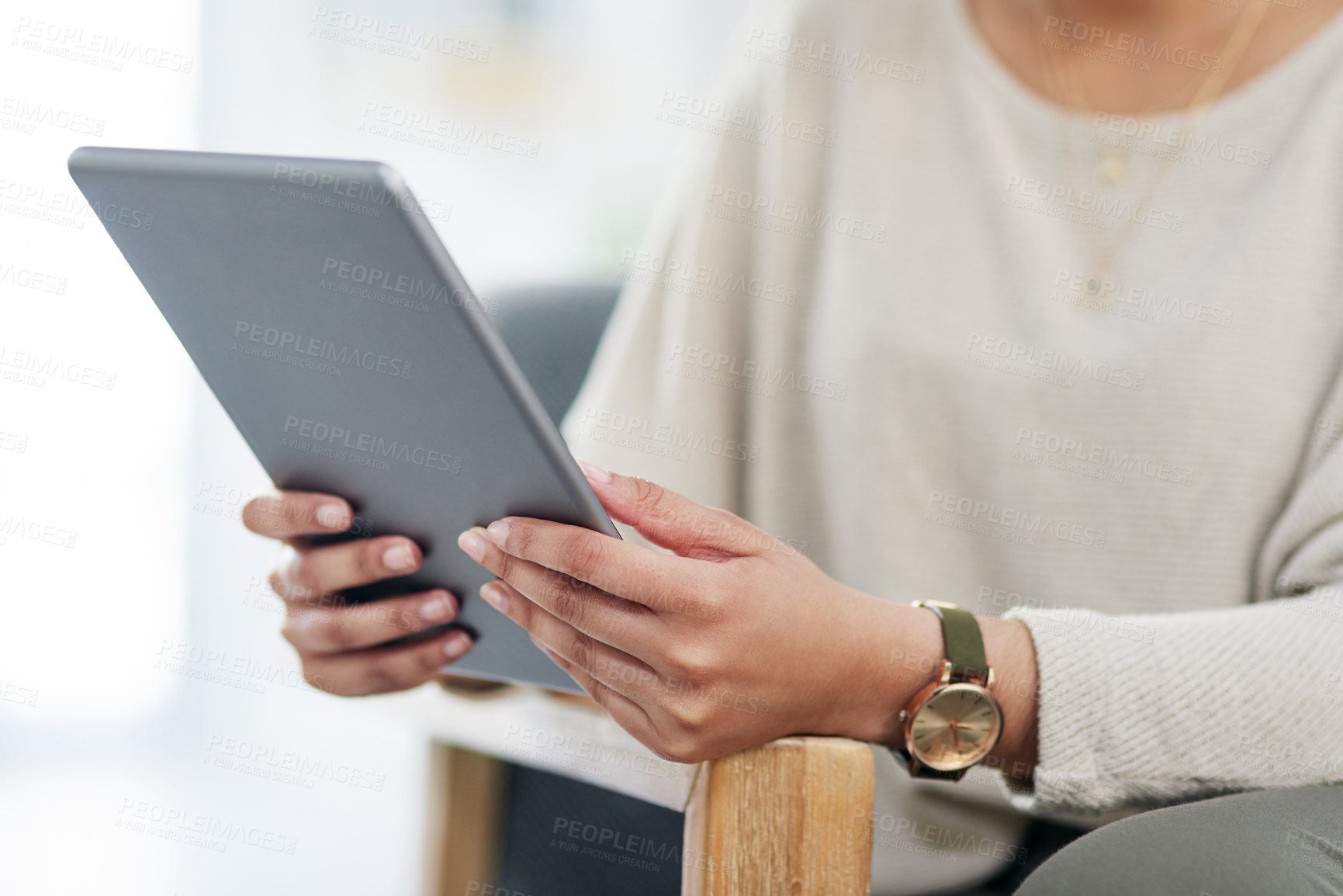 Buy stock photo Closeup shot of an unrecognisable businesswoman using a digital tablet in an office