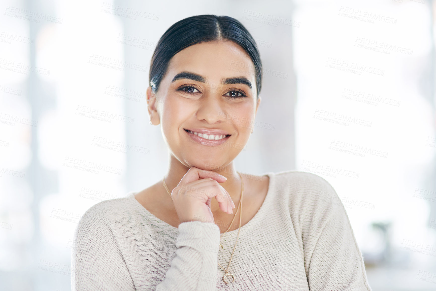 Buy stock photo Portrait of a confident young businesswoman standing in an office