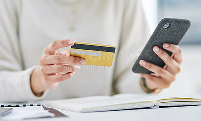 Buy stock photo Closeup shot of an unrecognisable businesswoman using a cellphone and credit card in an office