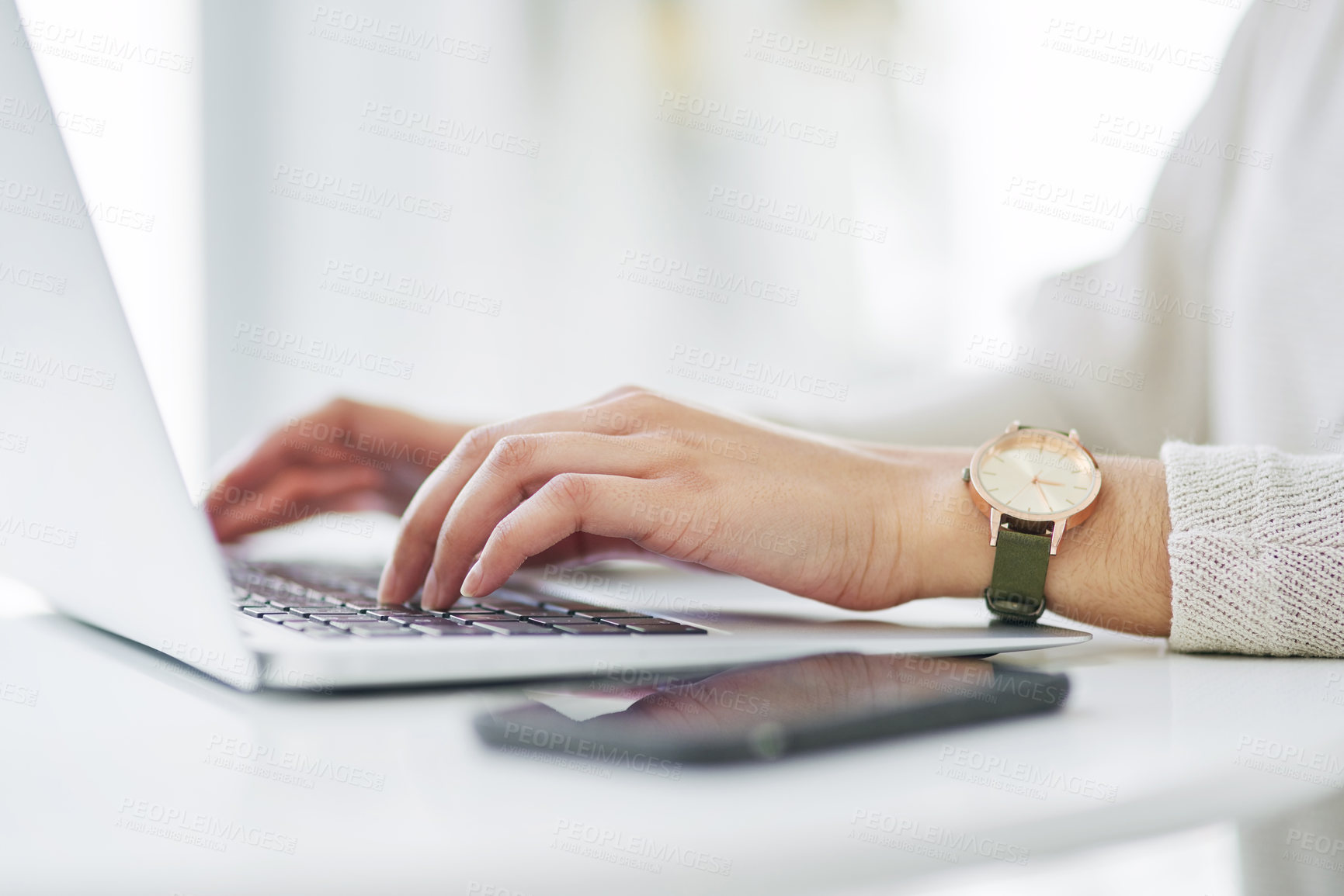 Buy stock photo Closeup shot of an unrecognisable businesswoman using a laptop in an office