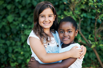 Buy stock photo Children, diversity and hug with girl friends outdoor in garden together for summer bonding. Love, portrait and smile with young kids embracing in nature or park for development, growth or support