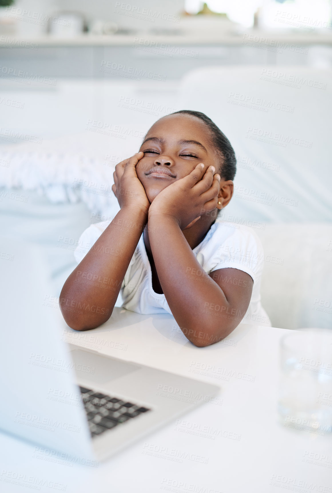 Buy stock photo Shot of a little girl looking bored at home