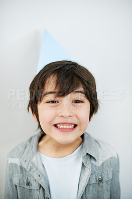 Buy stock photo Smile, party hat and portrait of Asian child in studio for birthday celebration or event. Happy, sweet and excited young boy kid with accessory for festive activity isolated by white background.