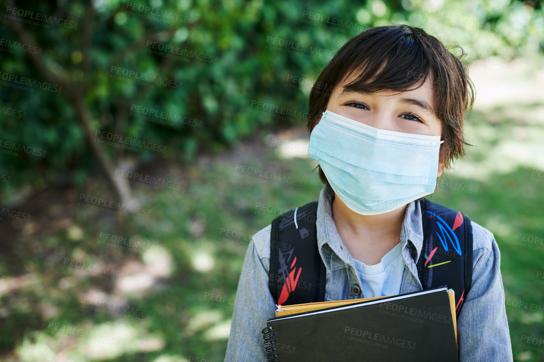 Buy stock photo Boy, face mask and ready for school in outdoor, confident and backpack for education. Male person, student and safety for virus or protect against germs, learning and child development at academy