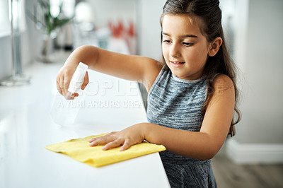 Buy stock photo Cloth, spray and child cleaning table in home for hygiene, chores or housekeeping maintenance. Girl, kid or wipe kitchen counter to disinfect for learning housework, education or help for development