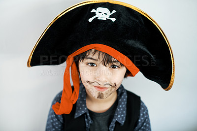 Buy stock photo Shot of a little boy wearing a pirate costume against a white background