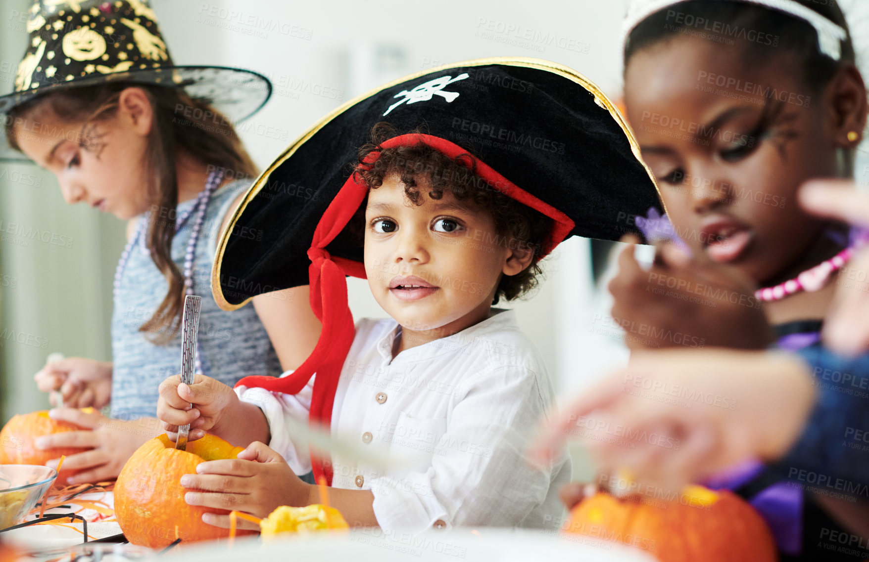 Buy stock photo Children, halloween and pumpkin with portrait of boy in pirate costume for holiday tradition. Carving, celebration and face of young kid with friends in home for break or decoration together
