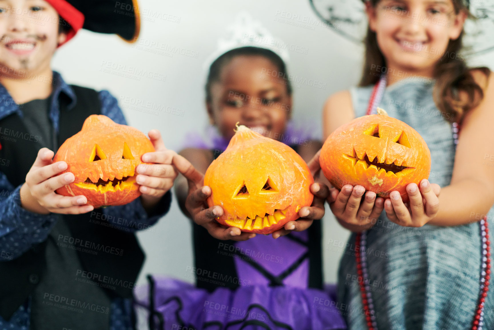 Buy stock photo Halloween, pumpkin and children in studio for party with fantasy costume, birthday and happiness. Orange vegetable, jack o lantern and young kids with creative fashion and smile by white background