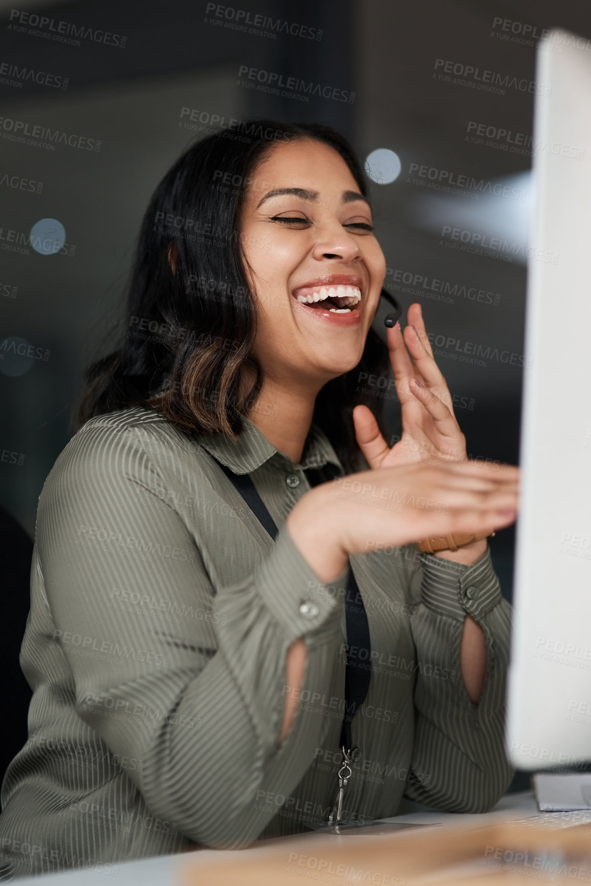 Buy stock photo Shot of a woman wearing a headset while looking at her desktop in a call centre