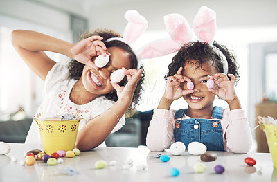 Buy stock photo Shot of two sisters playing together at home