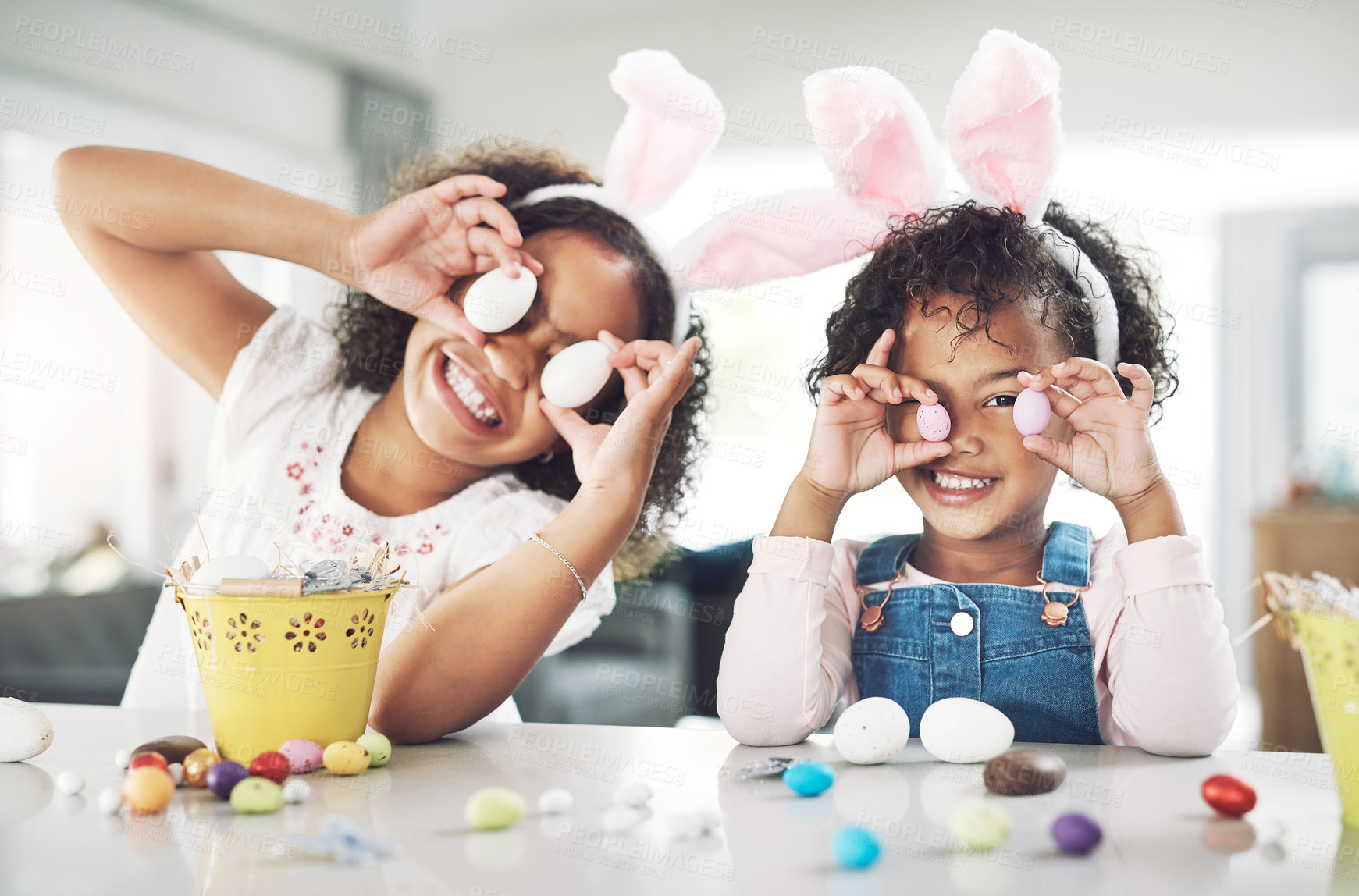 Buy stock photo Shot of two sisters playing together at home