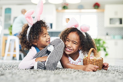 Buy stock photo Shot of two sisters playing together at home