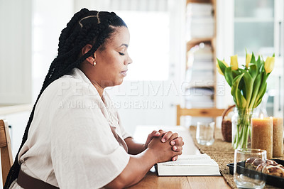 Buy stock photo Shot of a young woman praying at home