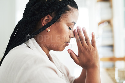 Buy stock photo Shot of a young woman praying at home