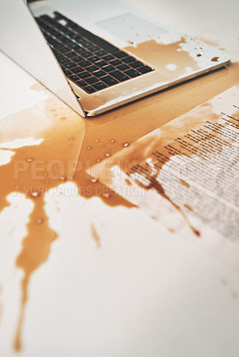 Buy stock photo Shot of coffee spilt over a laptop