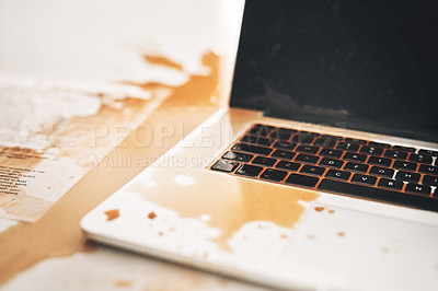 Buy stock photo Shot of coffee spilt over a laptop