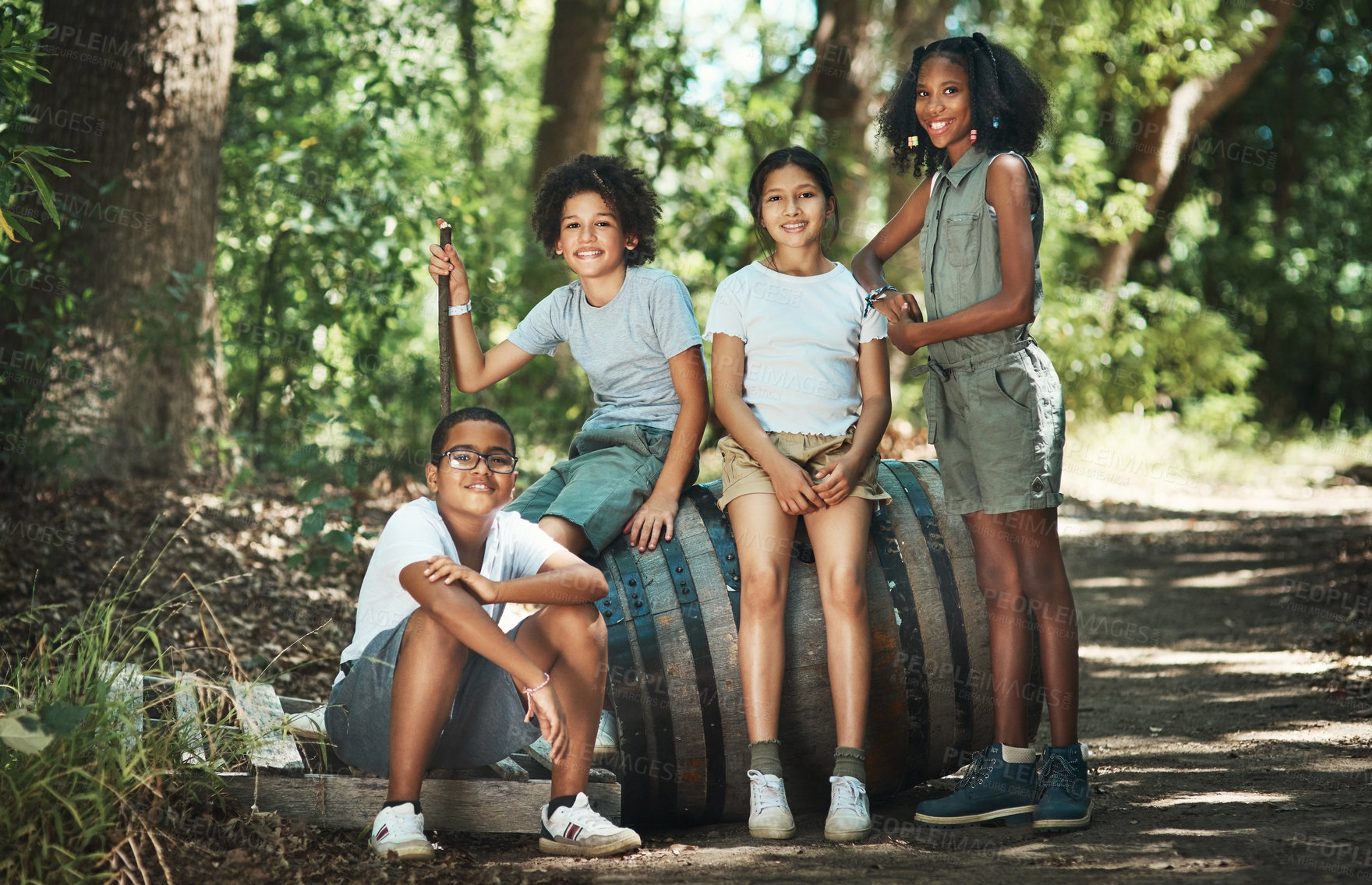 Buy stock photo Shot of a group of teenagers having fun in nature at summer camp