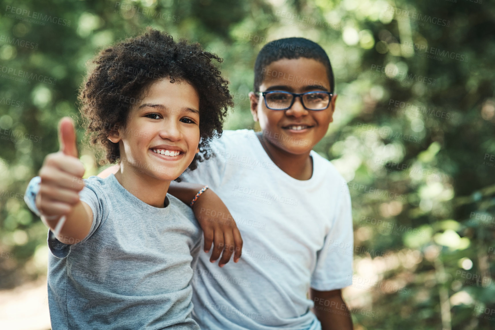 Buy stock photo Shot of two teenage boys showing thumbs up at summer camp