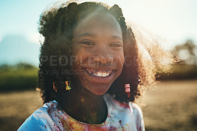 Buy stock photo Shot of a teenage girl having fun with colourful powder at summer camp