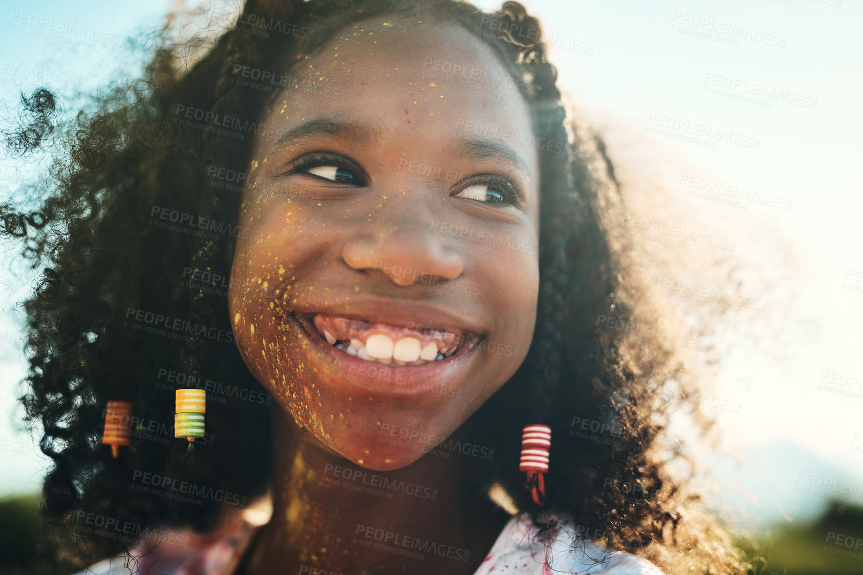 Buy stock photo Shot of a teenage girl having fun with colourful powder at summer camp