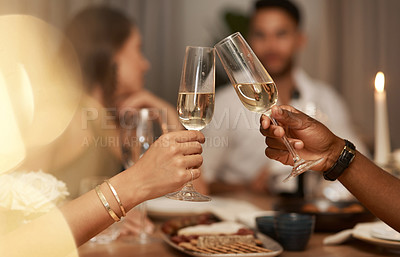 Buy stock photo Closeup, champagne and glasses for celebration, party or friends enjoy New Years dinner or drinks together. Hands, toast and alcohol for drinking, event and food for social gathering, cheers or relax