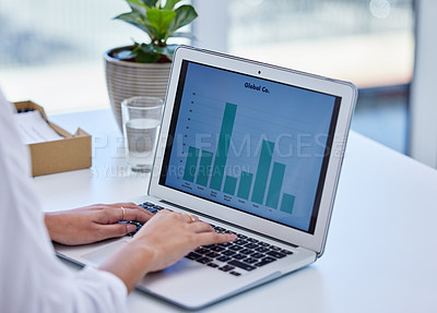 Buy stock photo Cropped shot of a businesswoman using a laptop in a modern office