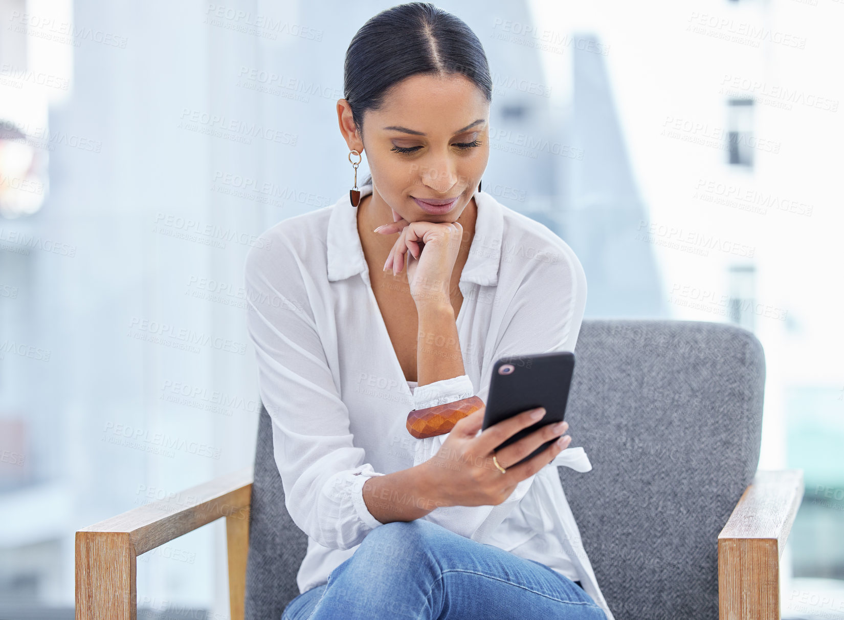 Buy stock photo Shot of a young businesswoman with her legs crossed in a modern office