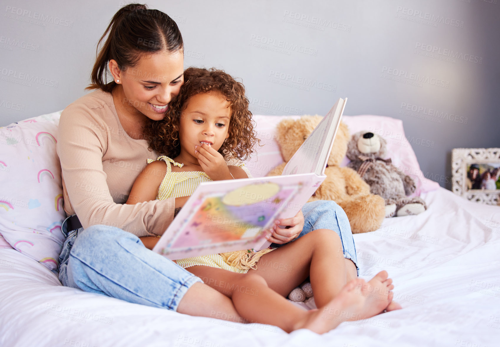 Buy stock photo Relax, book and mother with daughter in bedroom for storytelling, fantasy and creative. Education, learning and love with woman reading to girl in family home for happy, literature and fairytale