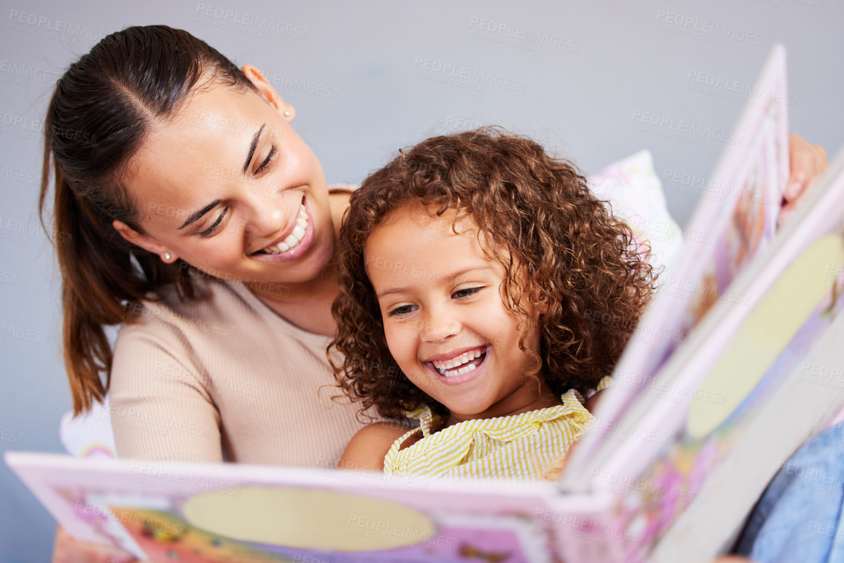 Buy stock photo Learning, book and mother with daughter in bedroom for storytelling, fantasy or creative. Education, study and love with woman reading to young girl in family home for fairytale, literature and relax