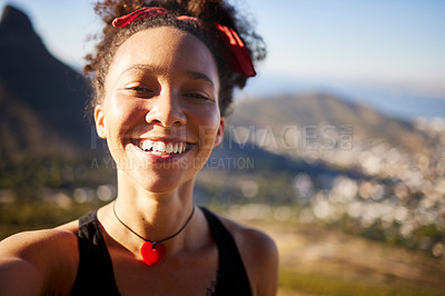 Buy stock photo Shot of a beautiful young woman out hiking in the mountains
