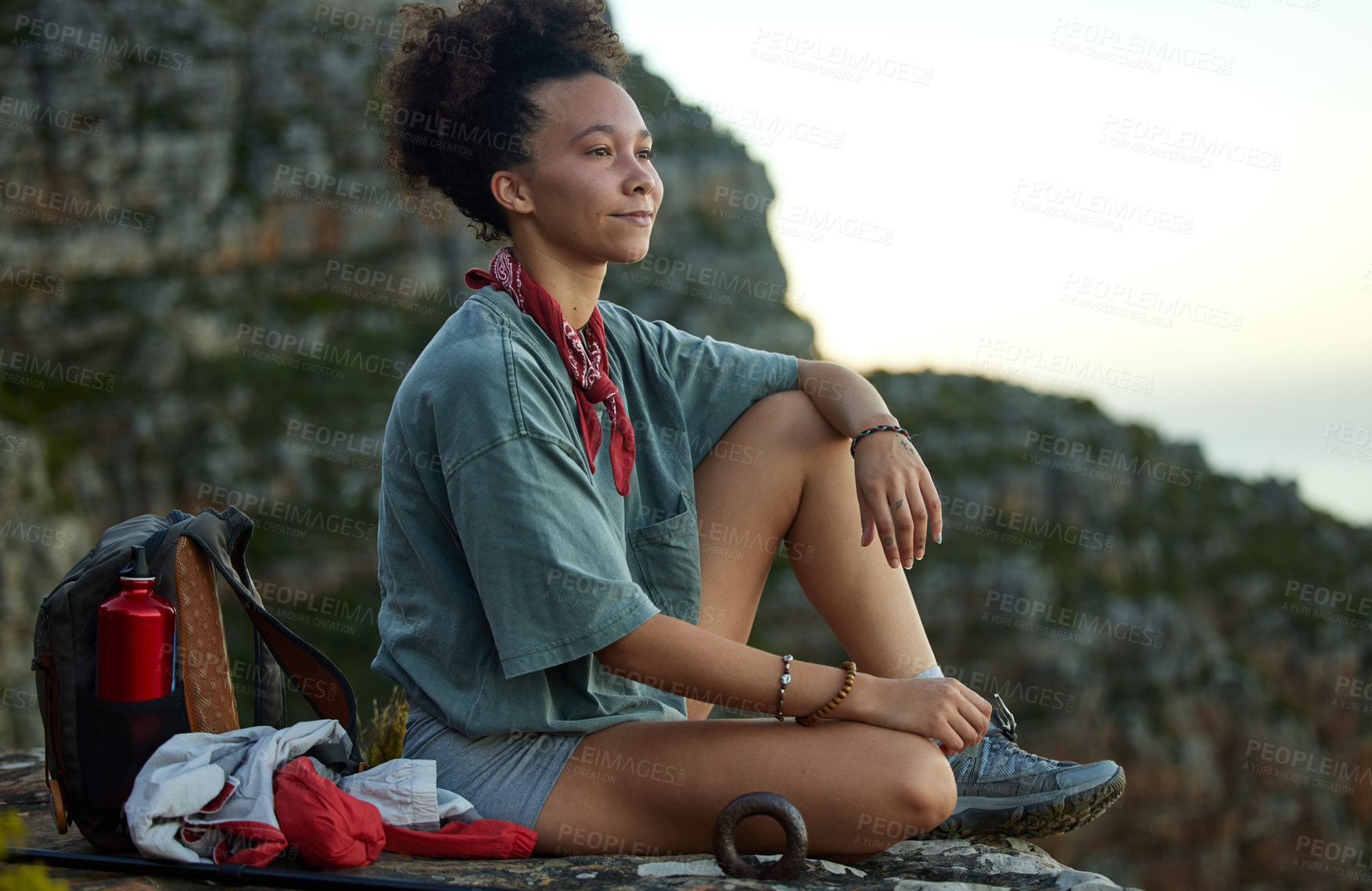 Buy stock photo Woman, hiking and resting on a mountain top with view for wellness and fitness in south africa. Female hiker, sitting and cliff with sunset in the outdoor for adventure and exercise for relaxing.