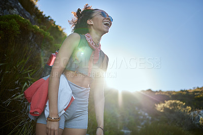 Buy stock photo Fitness, sport and woman hiking with smile in nature for wellness, exercise and walking adventure. Happy, female athlete and sunglasses for morning workout or training outdoors with lens flare