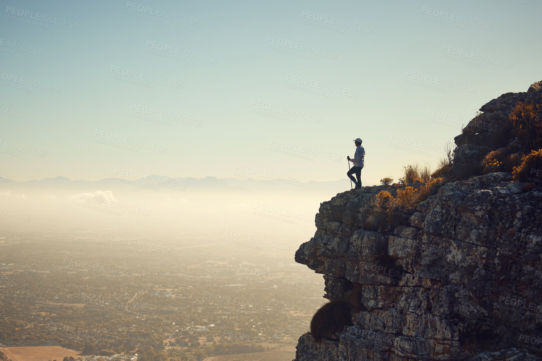 Buy stock photo Shot of a mature woman standing on a mountain in nature