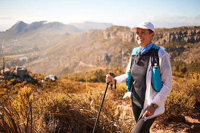 Buy stock photo Shot of a mature woman hiking in nature