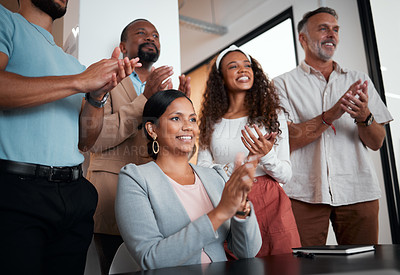 Buy stock photo Shot of a group of businesspeople applauding