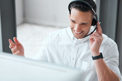 Buy stock photo Shot of a young male call center worker